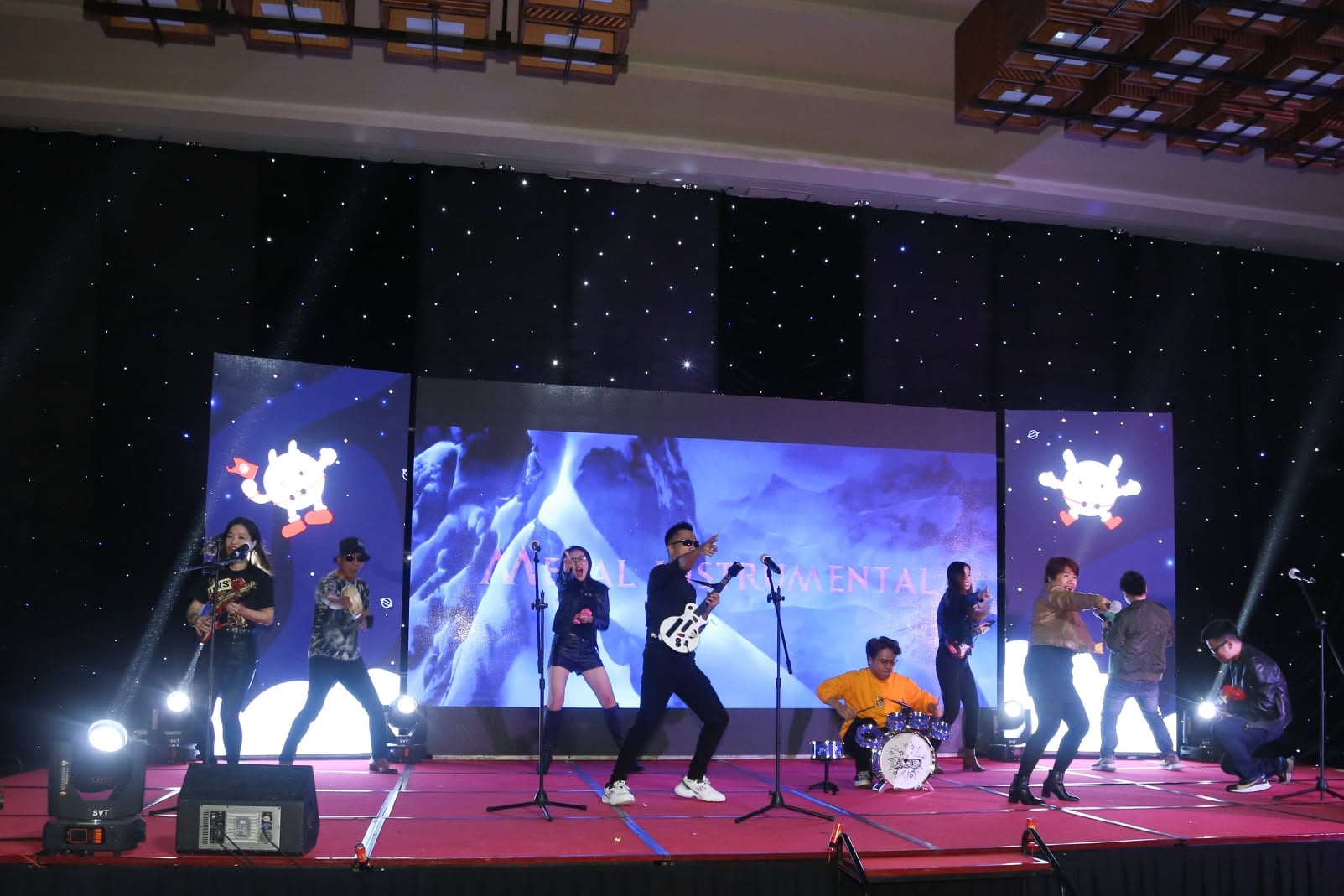 An Enouvo band performing together on stage