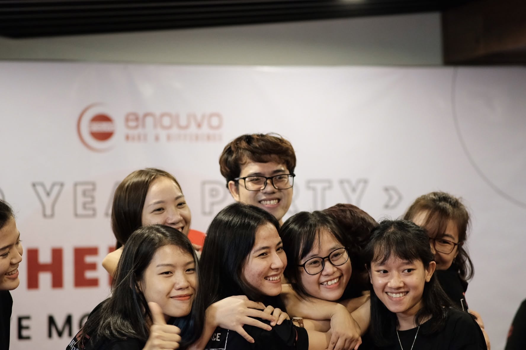 Enouvo colleagues gathering together at a company celebration
